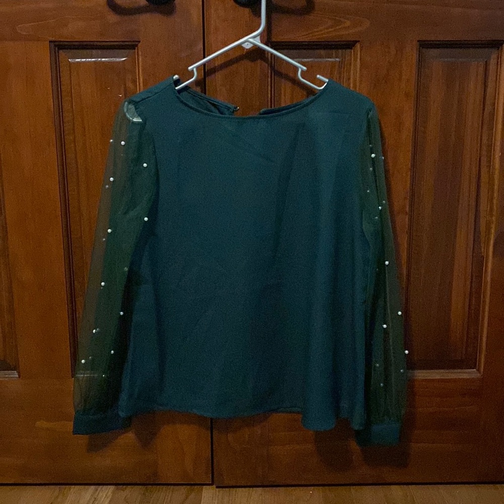 Green top with mesh sleeves and pearls